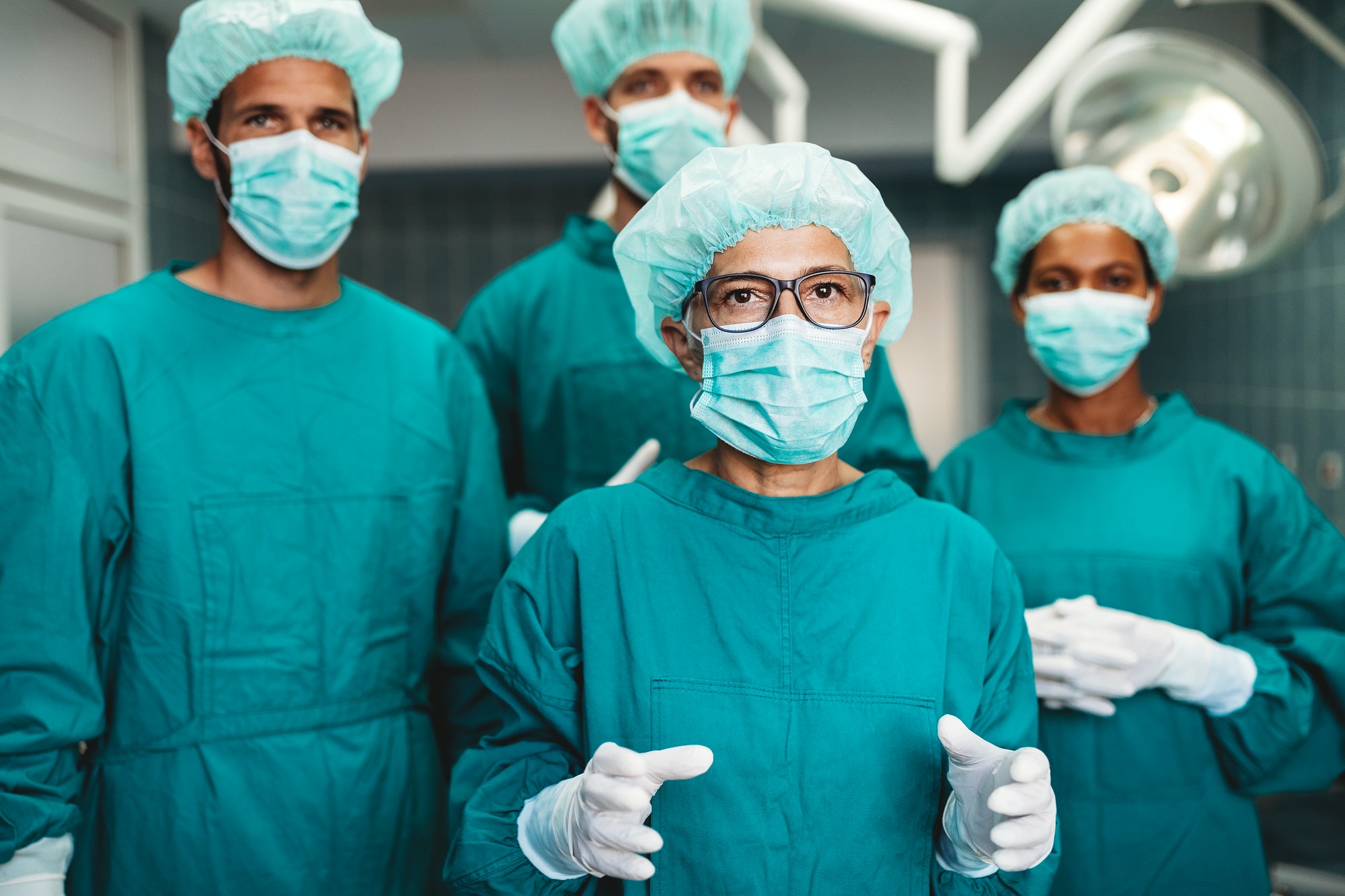 Team of surgeons in the operating room preparing for surgery